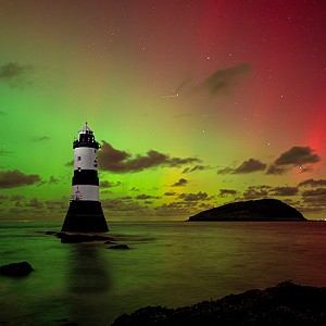 Magical colours of the Northern Lights at Trwyn Du lighthouse in Penmon, Anglesey.