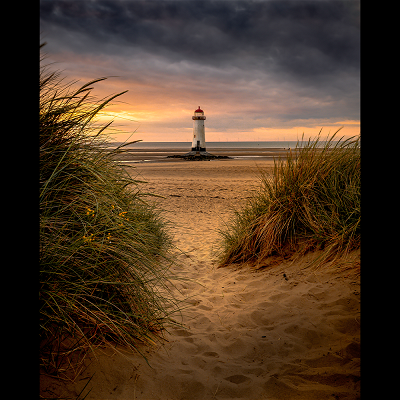 Sunset at Point of Ayr Lighthouse in Talacre beach in North Wales.