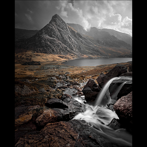 Afon Lloer cascade and Tryfan mountain in the Eryri / Snowdonia National Park, Wales