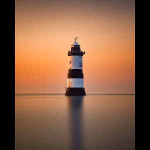 Warm sunset glow at Trwyn Du lighthouse, Penmon, Anglesey.