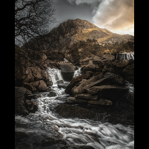 Tryfan mountain and Llyn Ogwen in the Ogwen Valley in the Eryri / Snowdonia National Park Wales.